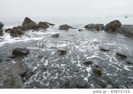 Wide view of waves beating on beach. Rocky sea Wide view of waves beating on beach. Rocky sea 63674159