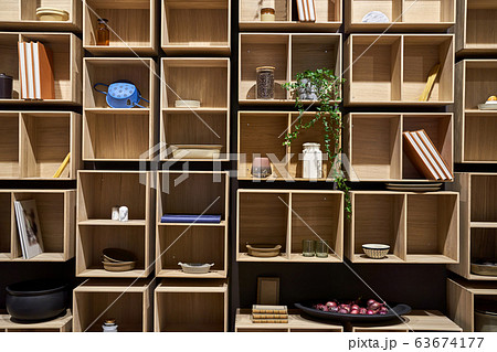 Construction of light wooden shelves with objects Construction of light wooden shelves with objects 63674177