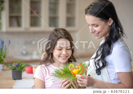 Mom and daughter preparing for easter abd feeling good Mom and daughter preparing for easter abd feeling good 63676121