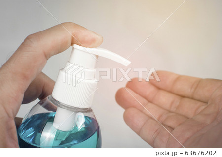 Ethyl Alcohol gel sanitizer,Men holds bottle for cleaning hand and used as disinfectant. Ethyl Alcohol gel sanitizer,Men holds bottle for cleaning hand and used as disinfectant. 63676202