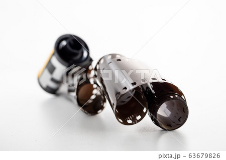A film roll on a white background. A film roll on a white background. 63679826