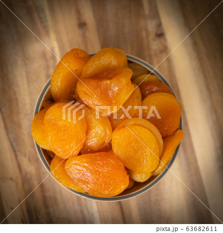 Dried fruit composition on wood background Dried fruit composition on wood background 63682611