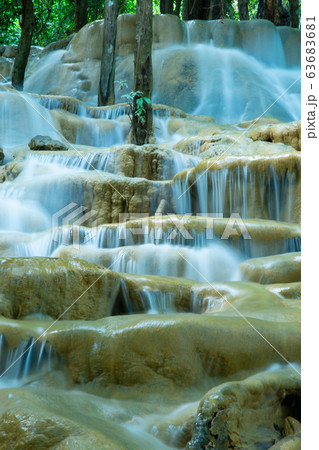 waterfalls in deep forest at Srinakarin National Park ,Kanchanaburi ,A beautiful stream water famous rainforest waterfall in Thailand waterfalls in deep forest at Srinakarin National Park ,Kanchanaburi ,A beautiful stream water famous rainforest waterfall in Thailand 63683681