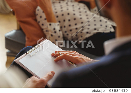 Woman lying on the couch at the therapy session Woman lying on the couch at the therapy session 63684459