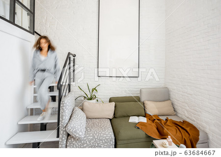 Living room with blurred human figure Living room with blurred human figure 63684667