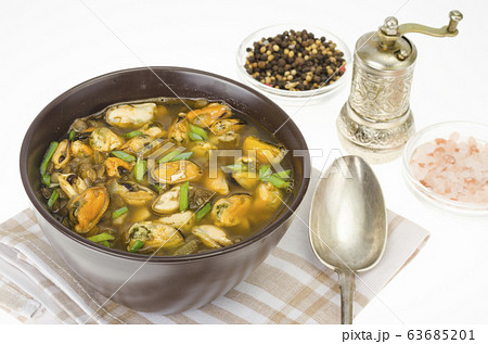 Hot spicy soup with mussels and vegetables 63685201