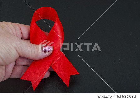 World AIDS Day, red ribbon, symbol. World AIDS Day, red ribbon, symbol. 63685633