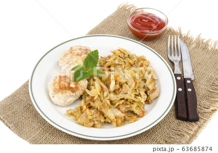 Homemade soy cutlets, fried cabbage on plate. 63685874