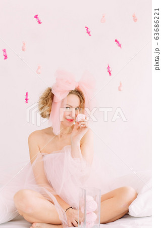 woman holiday marshmallows curly hair bow joy woman holiday marshmallows curly hair bow joy 63686221