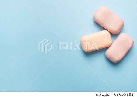 Natural soap on a blue pink background. Flat lay the concept of Spa cleanliness of hands. copy space Natural soap on a blue pink background. Flat lay the concept of Spa cleanliness of hands. copy space 63695882