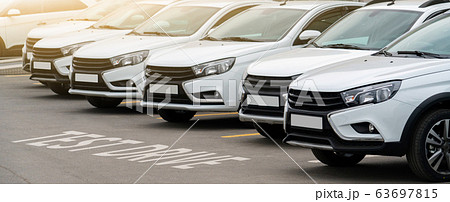 New cars in a row	 63697815