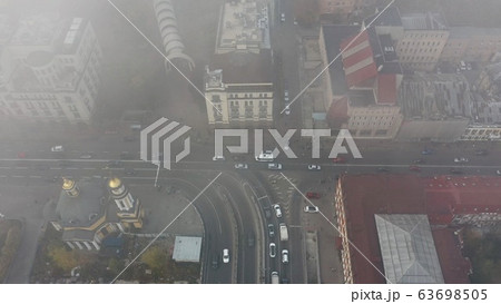 A city covered in fog. City traffic, aerial view 63698505