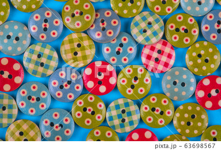 bright background made of multi- colored buttons. 63698567
