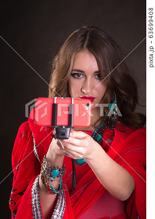 Woman in red sari 63699408