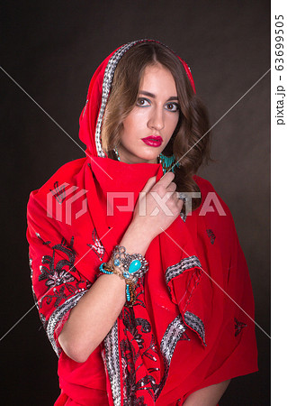 Woman in red sari 63699505