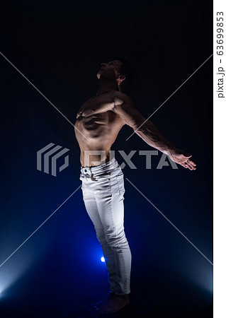Muscular man showing muscles isolated on the black background. Concept of goal, afford, creation your self, perseverance, fortitude, focus and labor 63699853