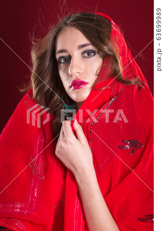 Woman in red sari Woman in red sari 63699989