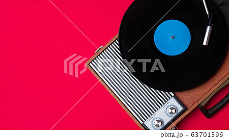 Retro vinyl player and turnable on a red Retro vinyl player and turnable on a red 63701396