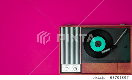 Classic vinyl player and record player on a Classic vinyl player and record player on a 63701397