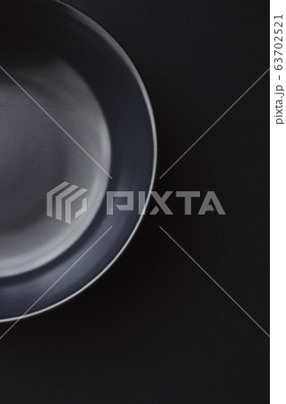 Empty plates on black background, premium dishware for holiday dinner, minimalistic design and diet Empty plates on black background, premium dishware for holiday dinner, minimalistic design and diet 63702521