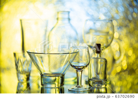 Glassware on abstract diffuse background in yellow 63702690