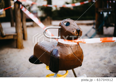 a closed playground where children are not allowed to play anymore 63704912