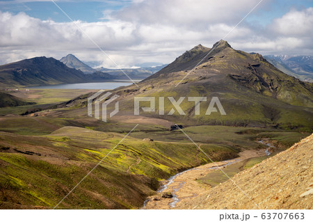 Green field with moss and mountain peak on the Laugavegur hiking trail, Iceland 63707663