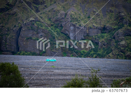 Iceland mountain view with 4x4 big bus. Waiting for tourists Iceland mountain view with 4x4 big bus. Waiting for tourists 63707673