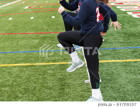Girls track team in a line standing in A-Position 63709107