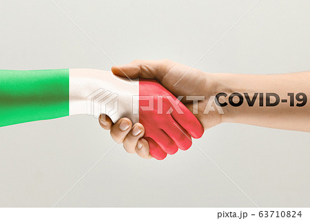 Human hands colored in flag of Italy and coronavirus - concept of spreading of virus 63710824