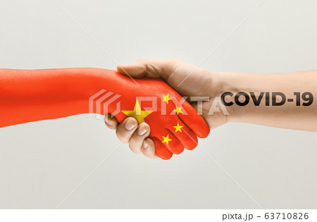 Human hands colored in flag of China and coronavirus - concept of spreading of virus 63710826