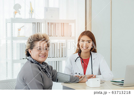 Asian doctor working in the office and discussing  63713218