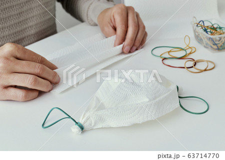 man making a homemade face mask 63714770