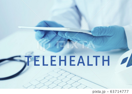 doctor man using a tablet and text telehealth doctor man using a tablet and text telehealth 63714777
