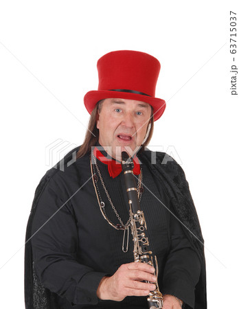 A clarinet player with a red hat and black outfit A clarinet player with a red hat and black outfit 63715037
