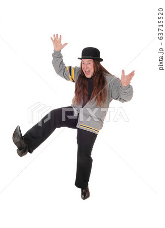 Happy jumping middle age man with long hair and 63715520