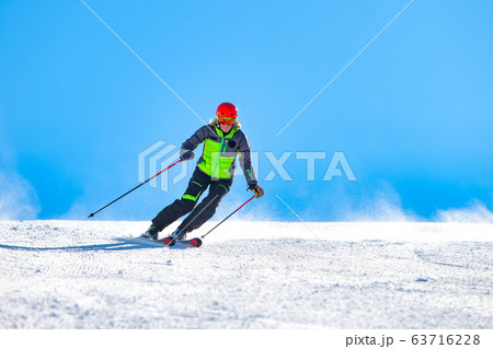 A girl skiing on the ski slope 63716228