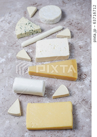 Various types of cheese on light brown background,top view Various types of cheese on light brown background,top view 63716712