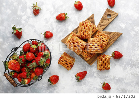 Sweet delicious strawberry cookies with ripe stawberries,top view Sweet delicious strawberry cookies with ripe stawberries,top view 63717302