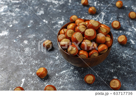 Hazelnuts on concrete background,top view 63717736