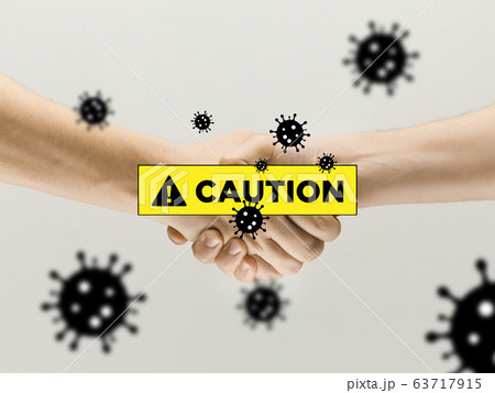 Human hands shaking, avoid greeting while coronavirus epidemic - concept of spreading of virus Human hands shaking, avoid greeting while coronavirus epidemic - concept of spreading of virus 63717915