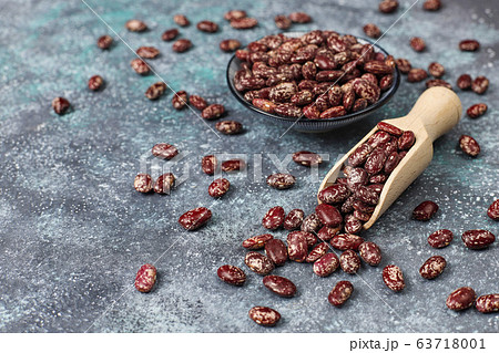 Legumes and beans assortment in different bowls on light stone background . Top view. Healthy vegan protein food. Legumes and beans assortment in different bowls on light stone background . Top view. Healthy vegan protein food. 63718001