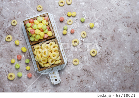 Various corn flakes in wooden boxes on concrete background Various corn flakes in wooden boxes on concrete background 63718021
