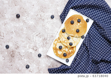 blueberry pancakes on brown light background,top view blueberry pancakes on brown light background,top view 63718040