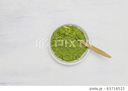 Word matcha made of powdered matcha green tea and bamboo spoon on white background. Copy space Word matcha made of powdered matcha green tea and bamboo spoon on white background. Copy space 63718525