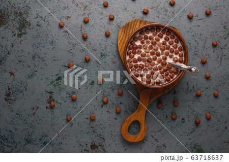 Bowl with chocolate balls and milk on light background,top view Bowl with chocolate balls and milk on light background,top view 63718637