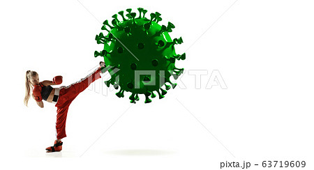 Professional sportswoman kicking, punching coronavirus model - fight the desease, flyer 63719609