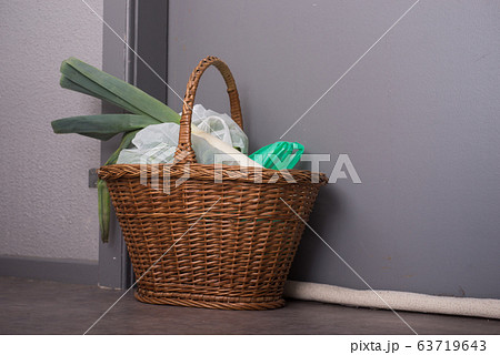 Shopping basket with goods and food hanging at Shopping basket with goods and food hanging at 63719643