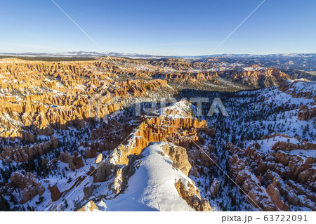 Bryce Canyon Hoodoos at Sunrise in Winter on Sunny Morning. Snow. Bryce Canyon National Park. Utah Bryce Canyon Hoodoos at Sunrise in Winter on Sunny Morning. Snow. Bryce Canyon National Park. Utah 63722091