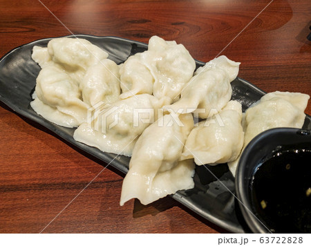 Close up shot of a plate of soup dumplings Close up shot of a plate of soup dumplings 63722828